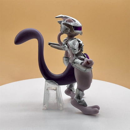 Mechanical cat-like figure with a purple tail on a white platform against a beige background